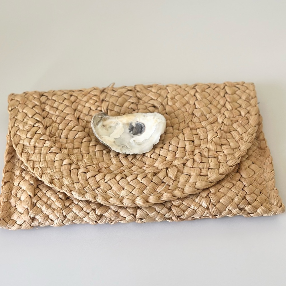 Woven clutch with oyster accent